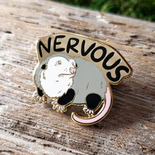 Load image into Gallery viewer, enamel pin of an opossum with the word "nervous" above it