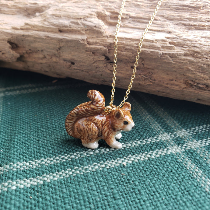 Porcelain squirrel pendant necklace, hand painted brown squirrel pendant on a gold chain.