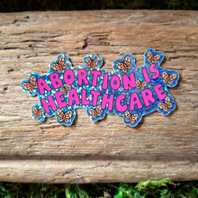 Load image into Gallery viewer, &quot;Abortion is Healthcare&quot; Glitter Sticker
