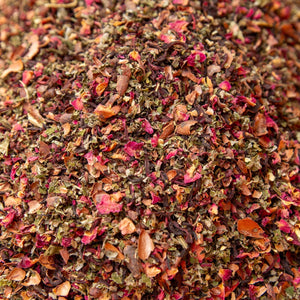 Close-up of crumbled dried herbs and petals in a heaping pile
