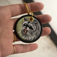 Load image into Gallery viewer, Scrappy Raccoon Embroidered Keychain
