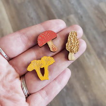 Load image into Gallery viewer, Little wooden mushroom pins, set of 3. Laser cut and hand painted here in Portland Oregon. Use as brooches or lapel pins.
